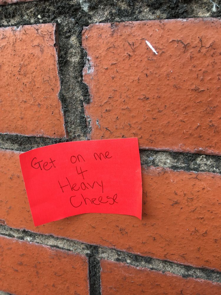 a sign saying get on me for heavy cheese