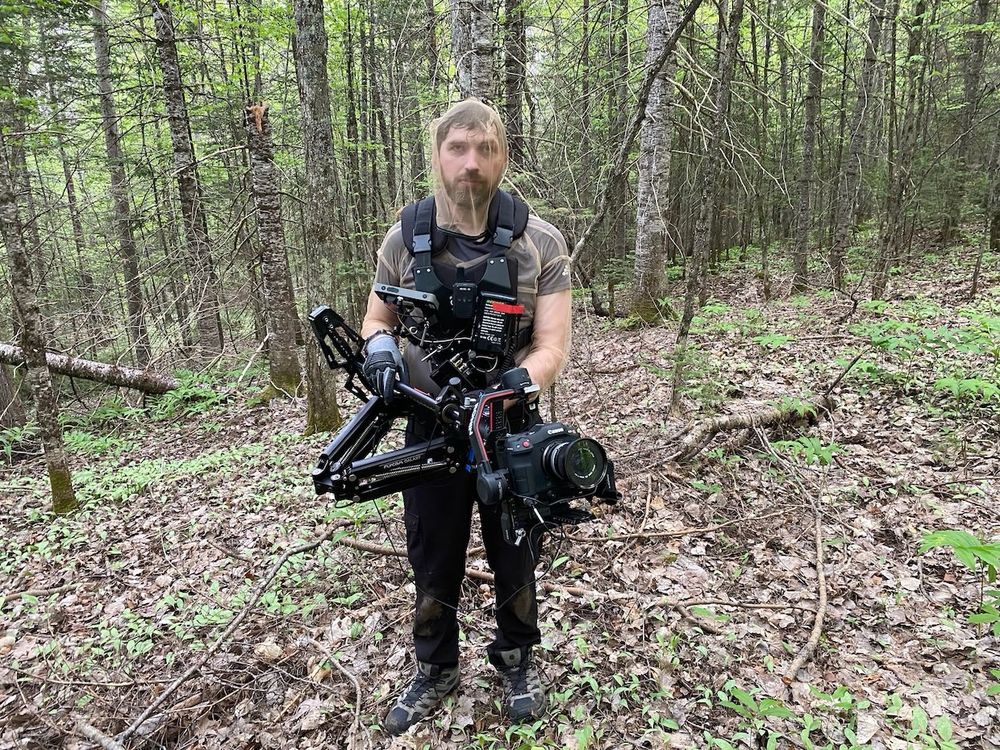 Pierce Derks holds a camera on location for IN A VIOLENT NATURE. 