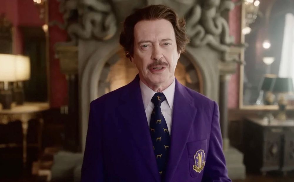 Principal Dort (Steve Buscemi) in a purple blazer from a scene Wednesday 2. 