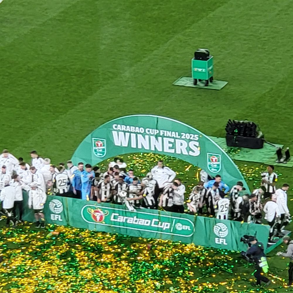 Players under the winners arch on the Wembley pitch.