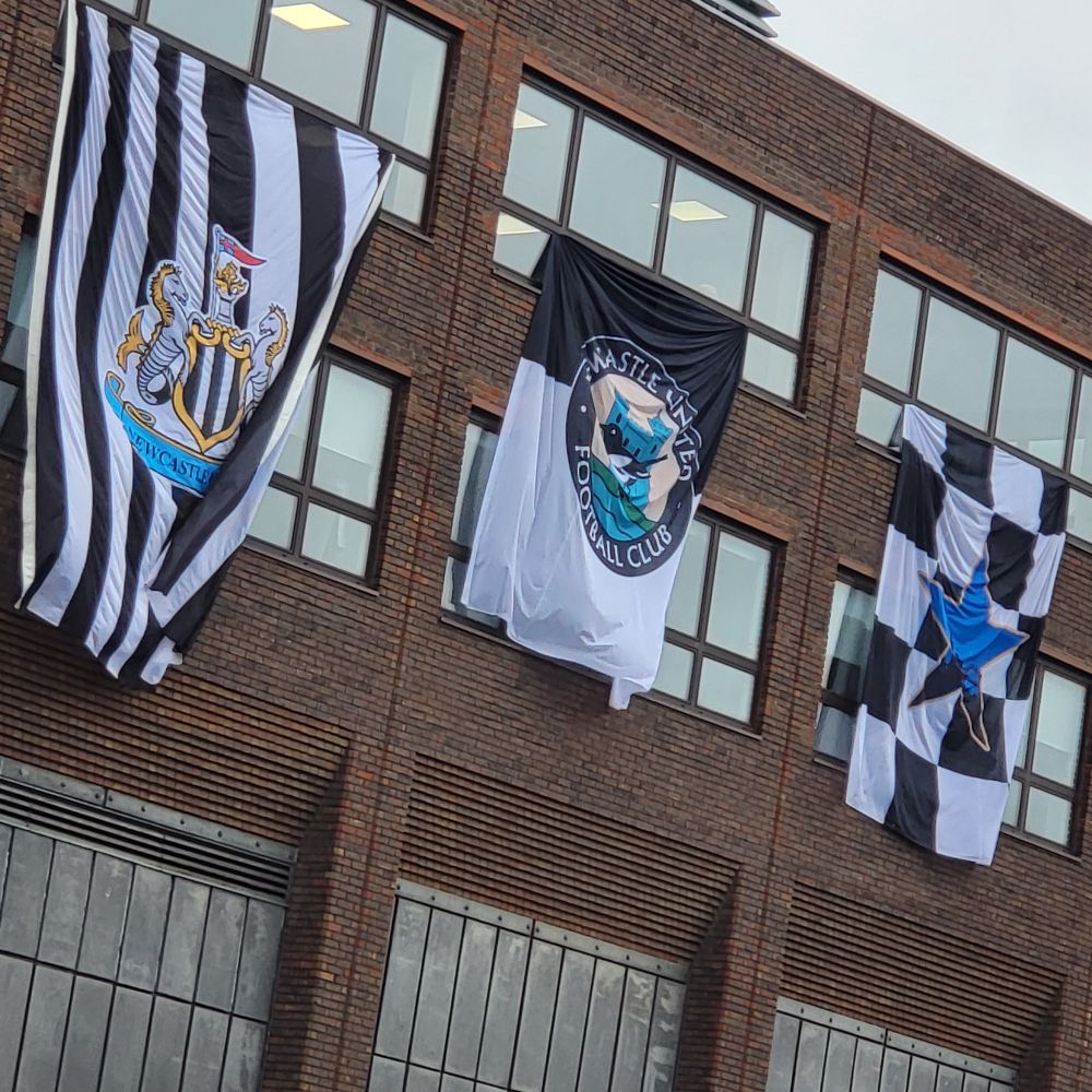Newcastle United flags hung from windows 