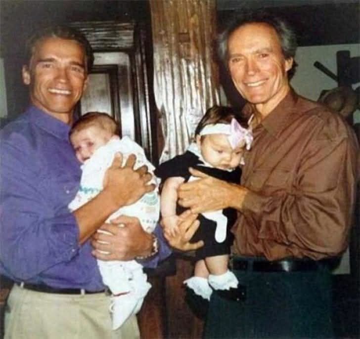 Arnold Schwarzenegger with his son, Patrick, and Clint Eastwood with his daughter, Francesca, 1993