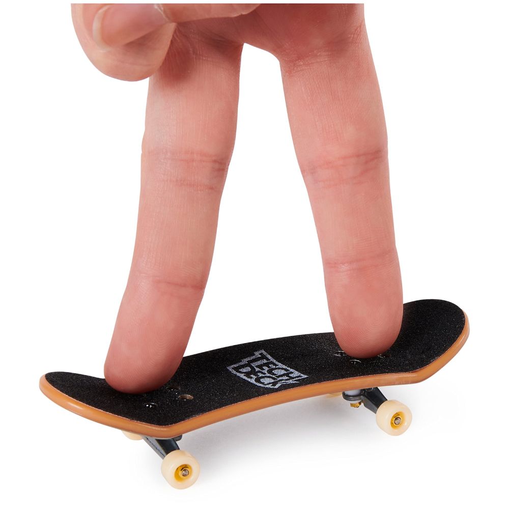 Two fingers on a mini-skateboard (AKA tech deck)