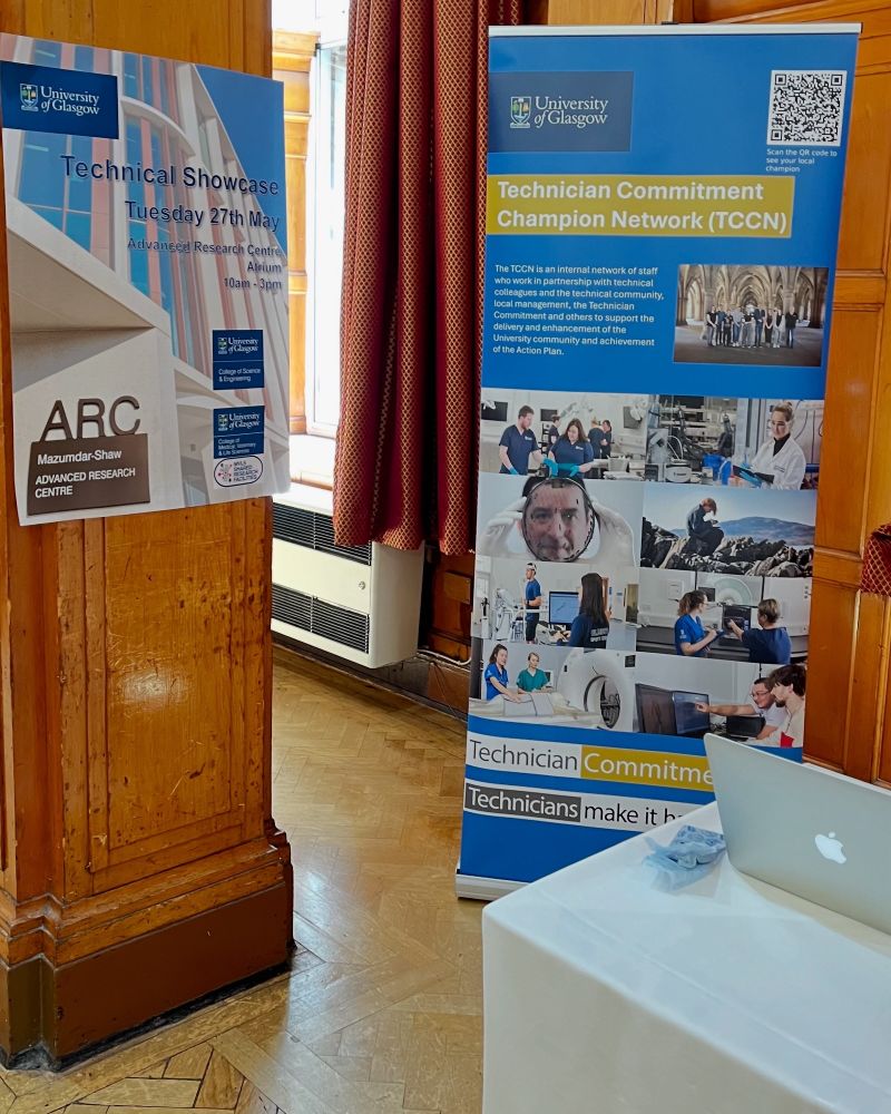 Photograph of an exhibitor display with two posters.  One for a Technical Showcase taking place on 27th May and the other to show the University of Glasgow Technician Commitment Champion Network.