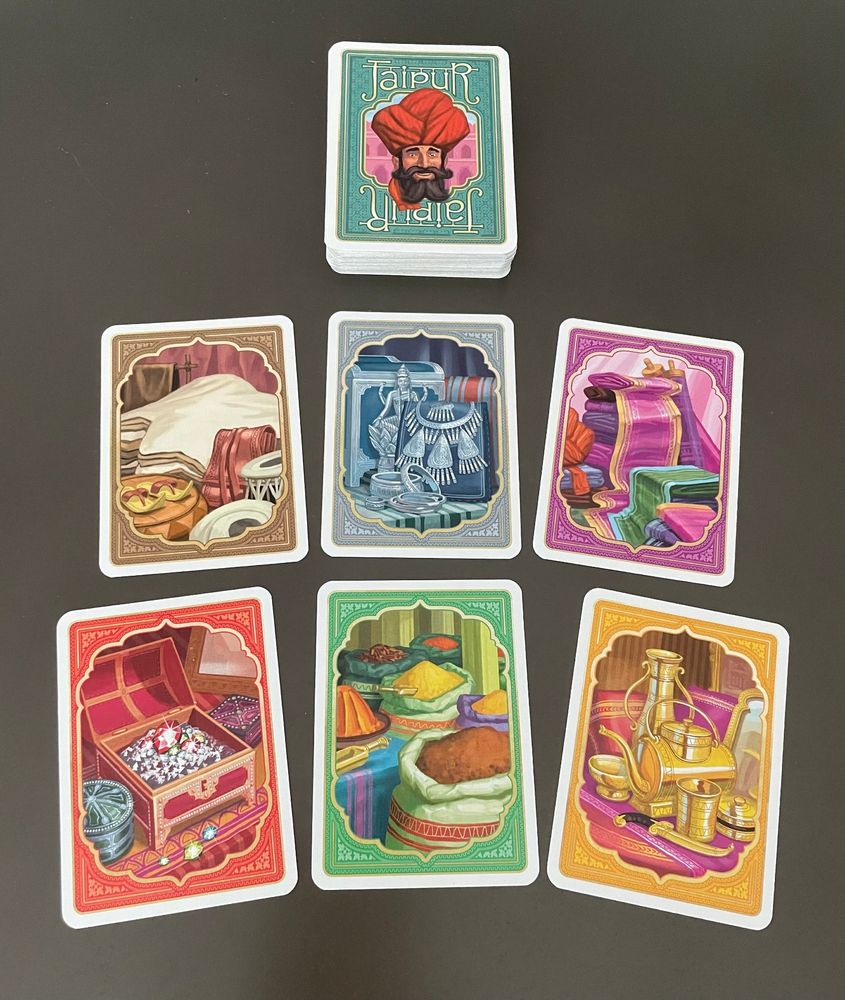 Close up of the game cards from Jaipur showing the various goods. 