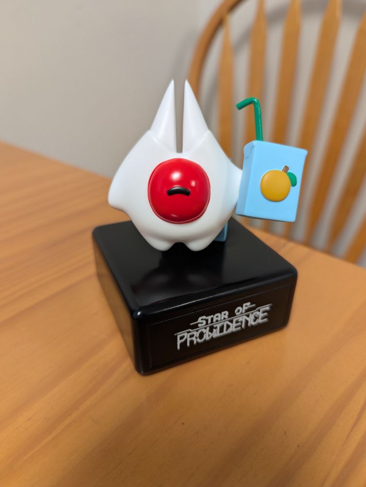 White and red toy on a table 
