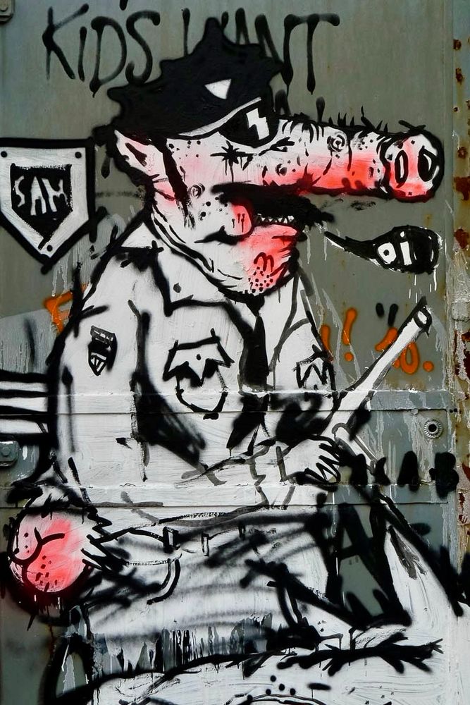 Street art of a pig in a police uniform. In Germany the police are known as “bulls” rather than “pigs” but they say it’s a land of equal opportunity. It’s not.