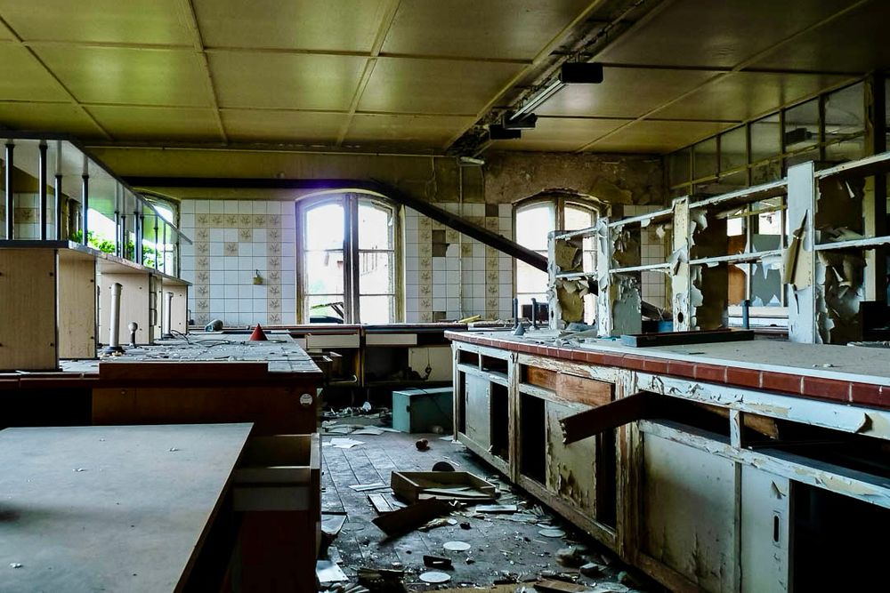Inside an abandoned brewery after several parties too many. Everything is pretty smashed. No bodies though, they must have been eaten. 