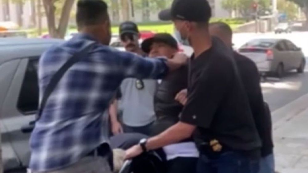A man yelled for help as a group of men – one of whom said he was with Immigration and Customs Enforcement – picked him up and pushed him into a car outside a Los Angeles courthouse Wednesday, video s...