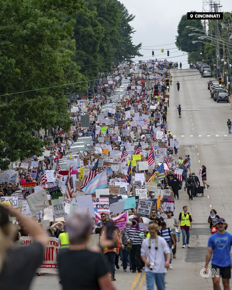 Demonstrators, many carrying signs, march down a street in Cincinnati, Ohio. | Jason Whitman/NurPhoto/Associated Press