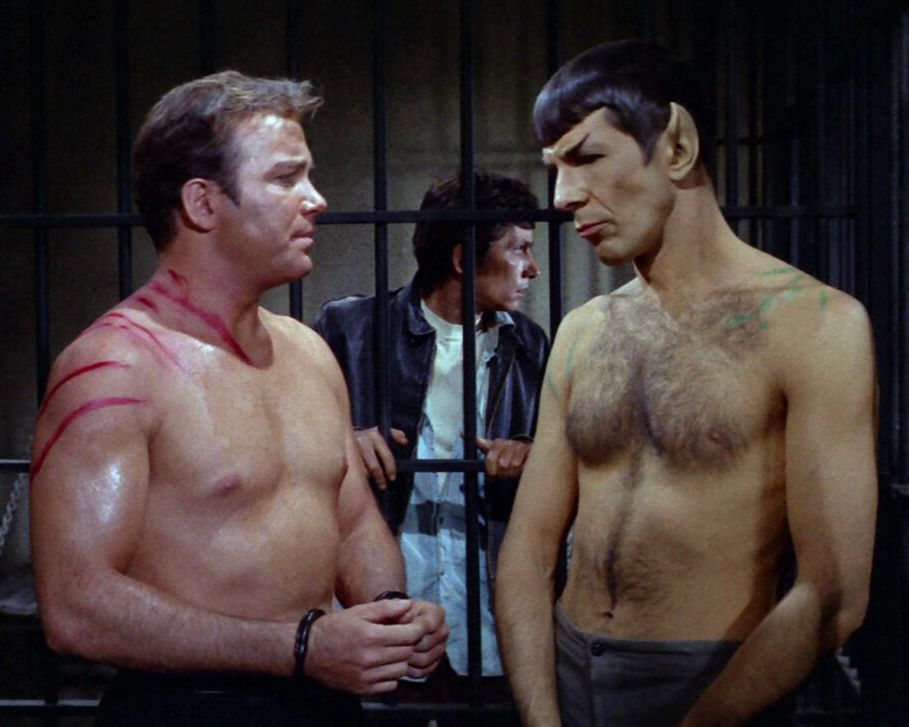 Kirk and Spock, shirtless behind bars