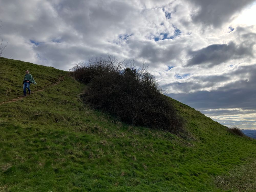 Joseph Chance descending a hill with scarf blowing in the wind.