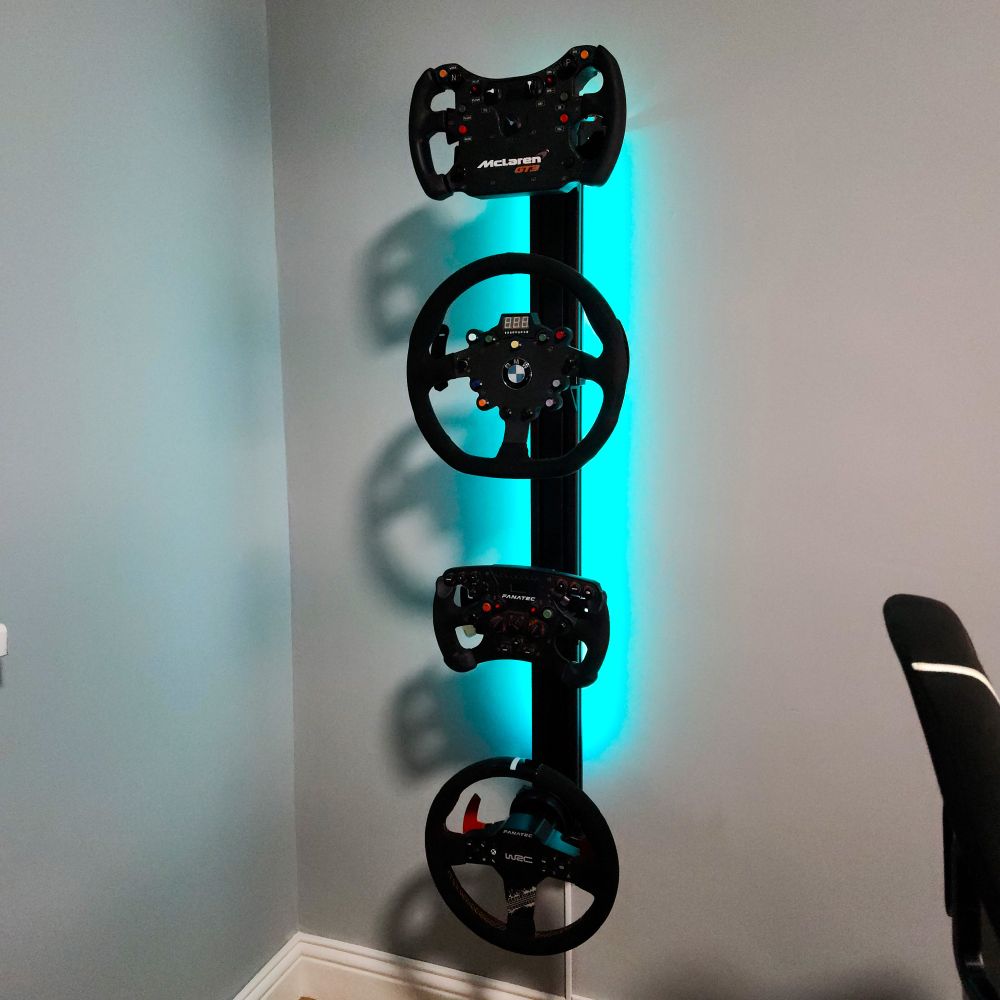 A picture of my sim racing wheel display showing my Fanatec Formula V2.5, CSL Elite WRC, BMW M3 GT4 & McLaren GT3 V2 wheels.