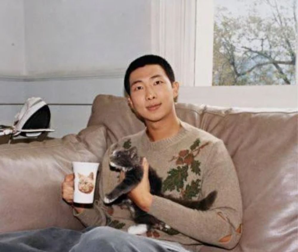 KIM NAMJOON HOLDING TEA AND A CAT