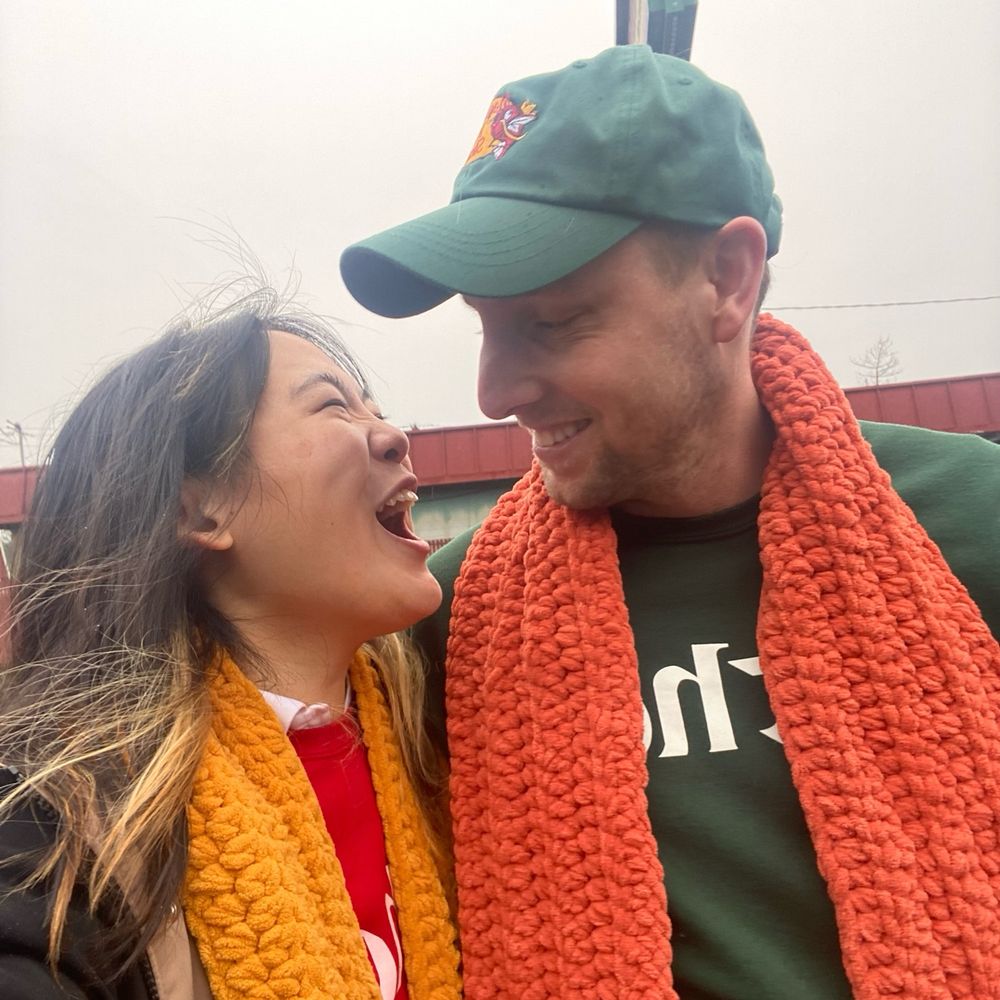 a irl picture of me and my partner wearing the scarves i made!