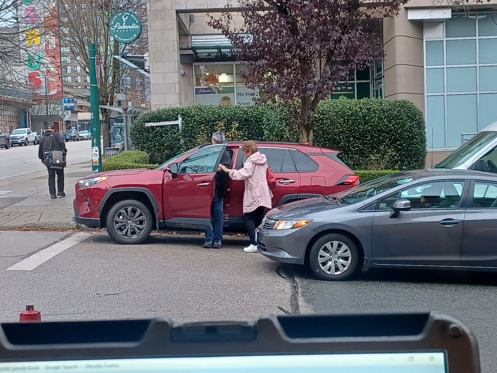 Person red hatchback has been waiting for changes places with hatchback driver.