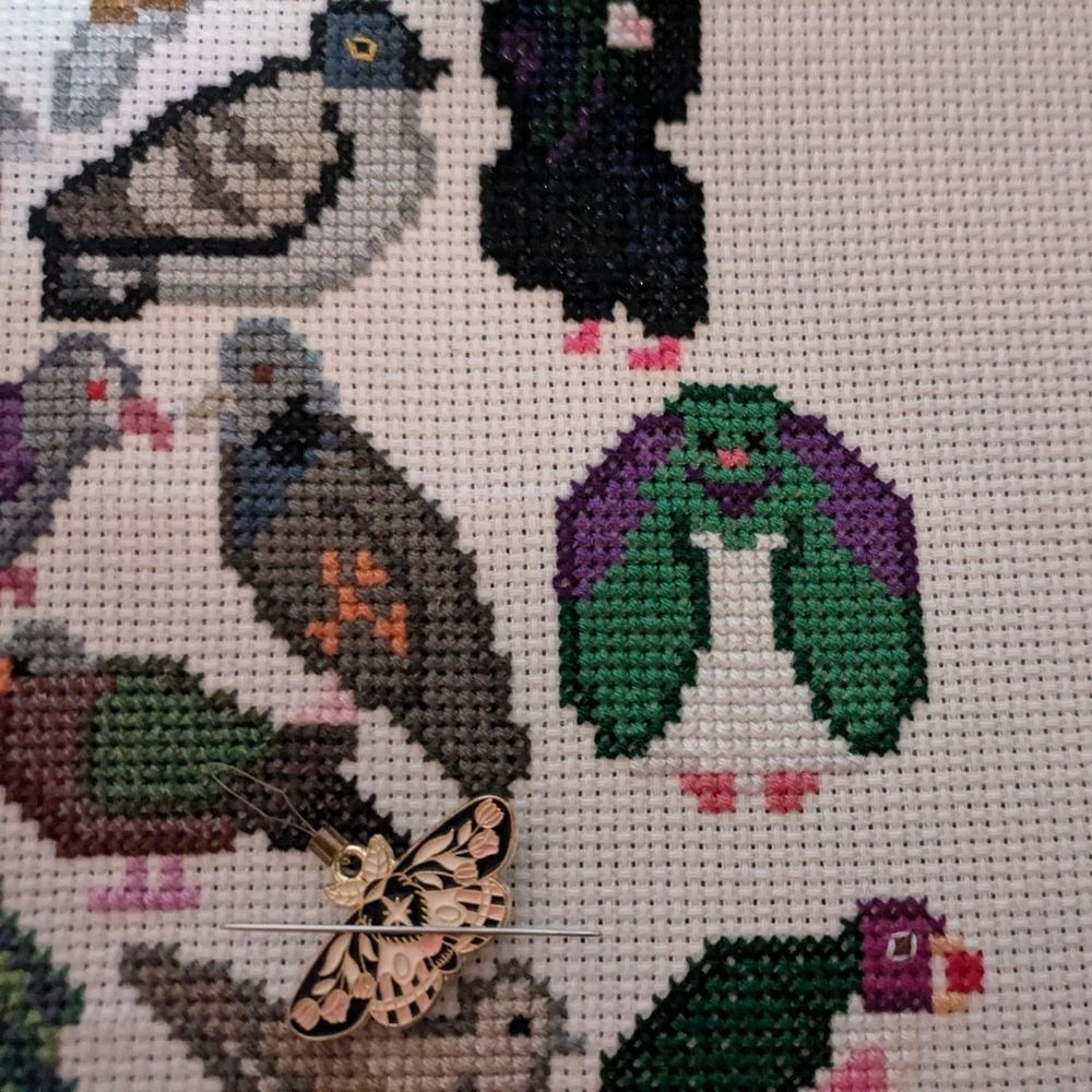 WIP cross stitch work featuring pigeons from last year's Avian August.