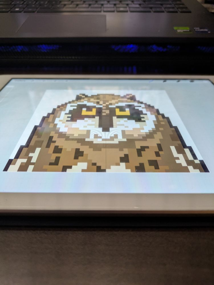 A skewed pixel portrait of a Pueo (Hawaiian shirt eared owl) 