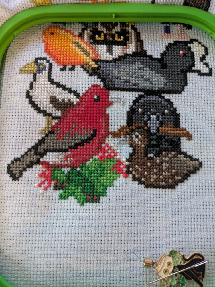 A grouping of cross stitched birds with newly featured, masked booby, ʻAlalā and Hawaiian duck.