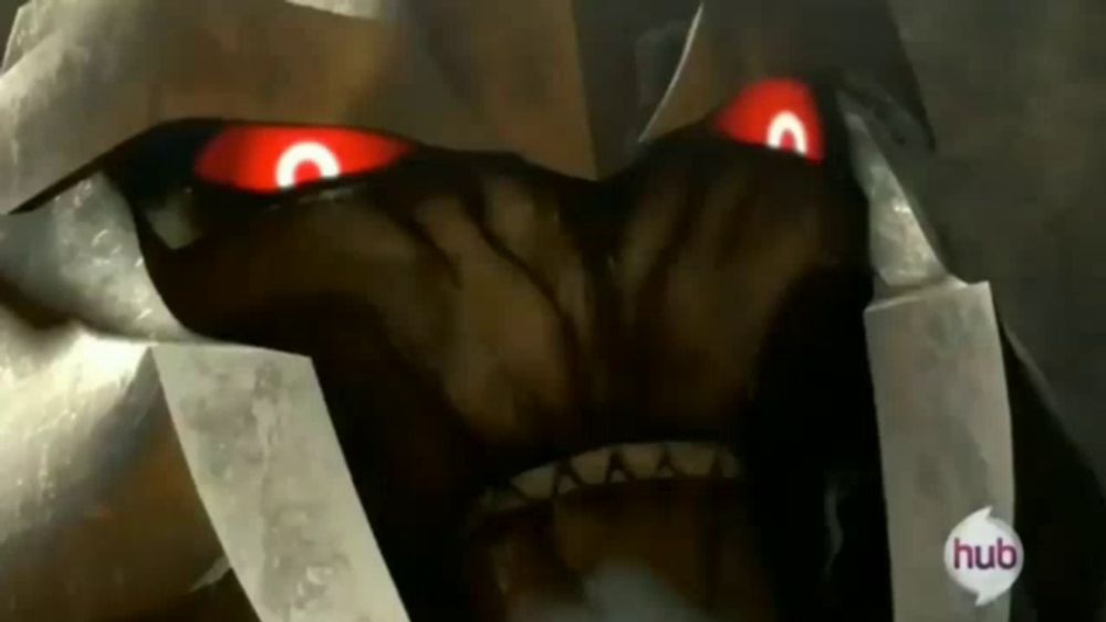 a close up of a monster 's face with red eyes and the word hub on the bottom