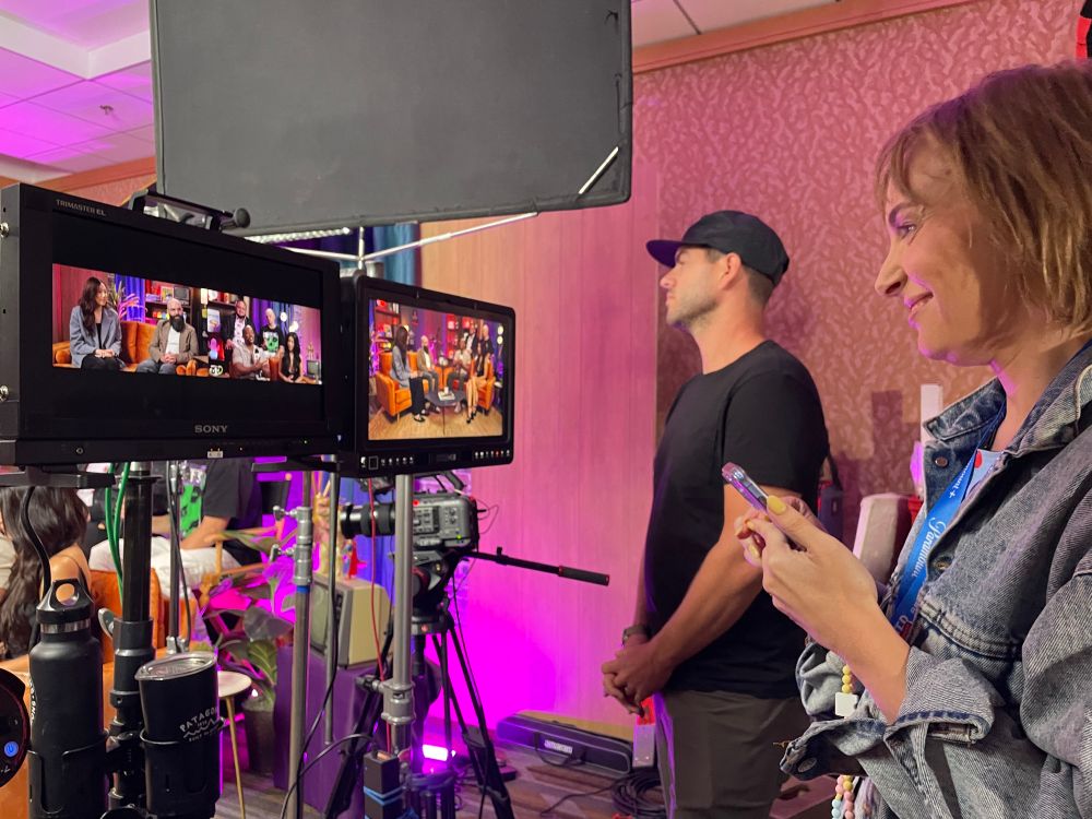 Woman looks admiringly at a director’s monitor
