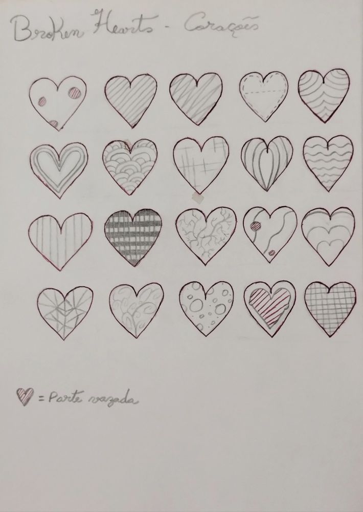 Página de caderno com vários tipos de corações desenhados.