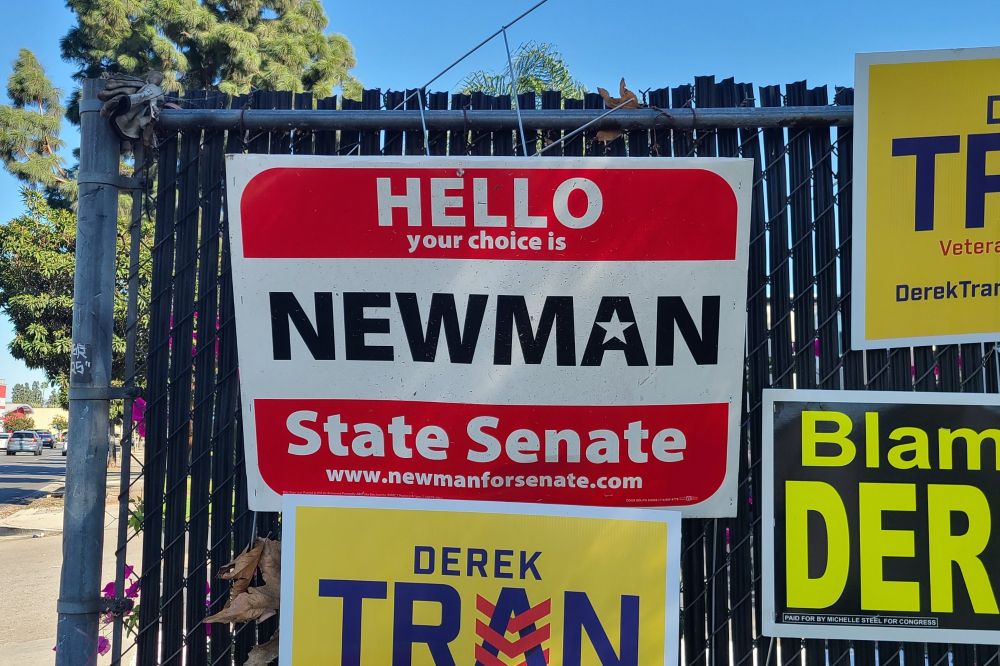 Government campaign sign for Newman.