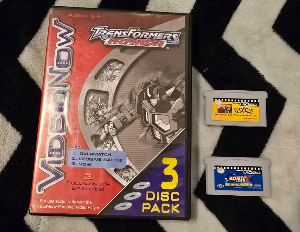 A VideoNow 3 disc pack of Transformers Armada episodes and GBA Video carts of Pokémon and Sonic X.