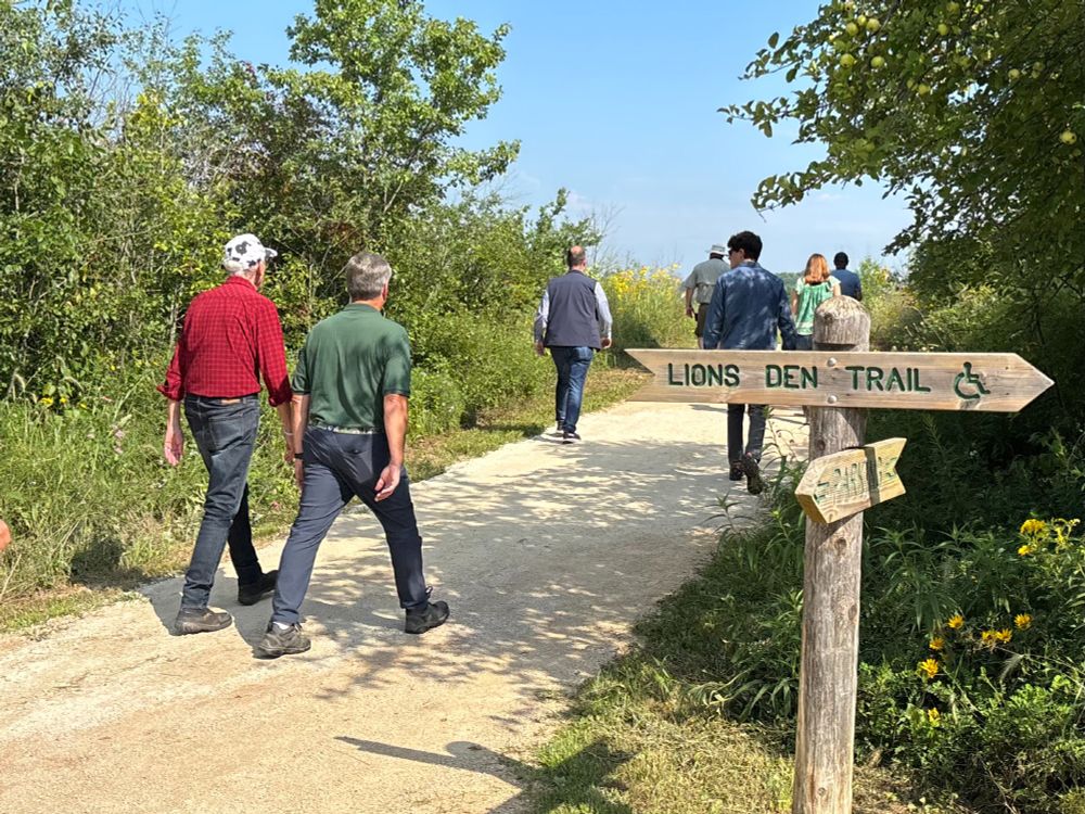 Gov. Evers walks trail.