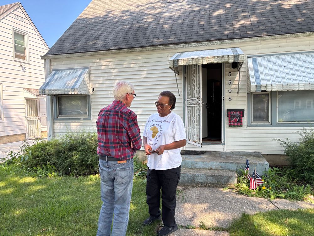 Gov. Evers talks to homeowner 