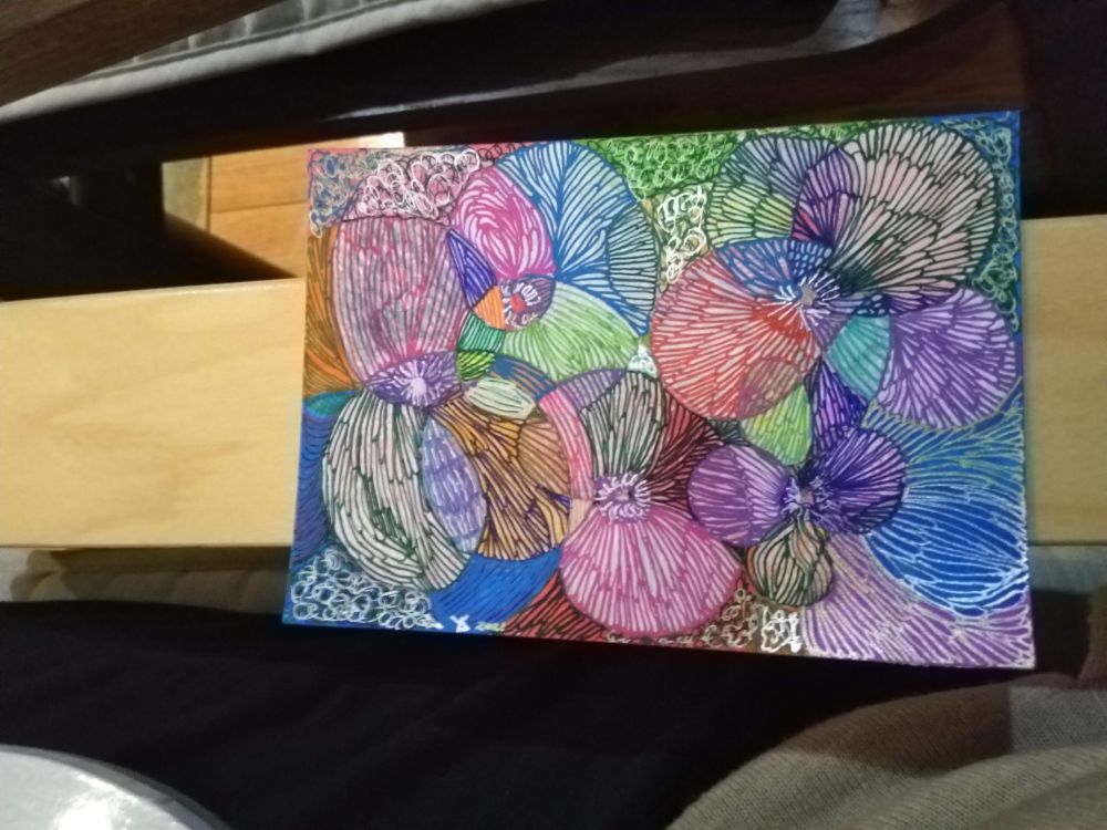 A small drawing of abstract pansies of many colours, made with gel pens and markers in 2021.