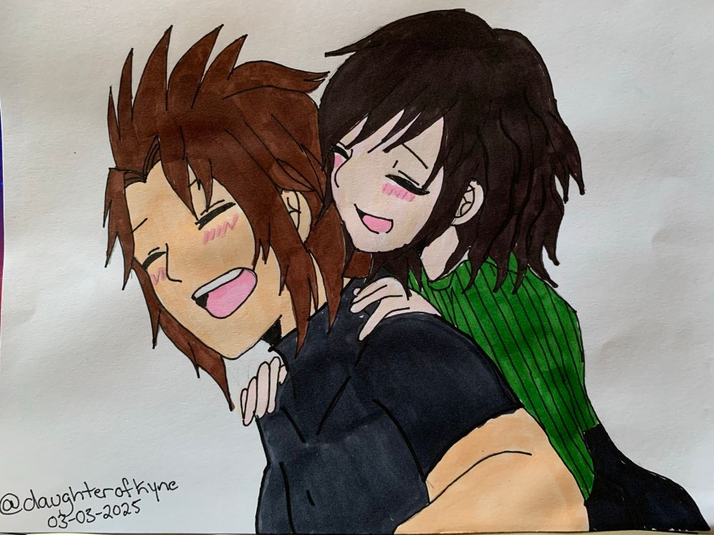 Terra is smiling while Emma hugs him from behind 