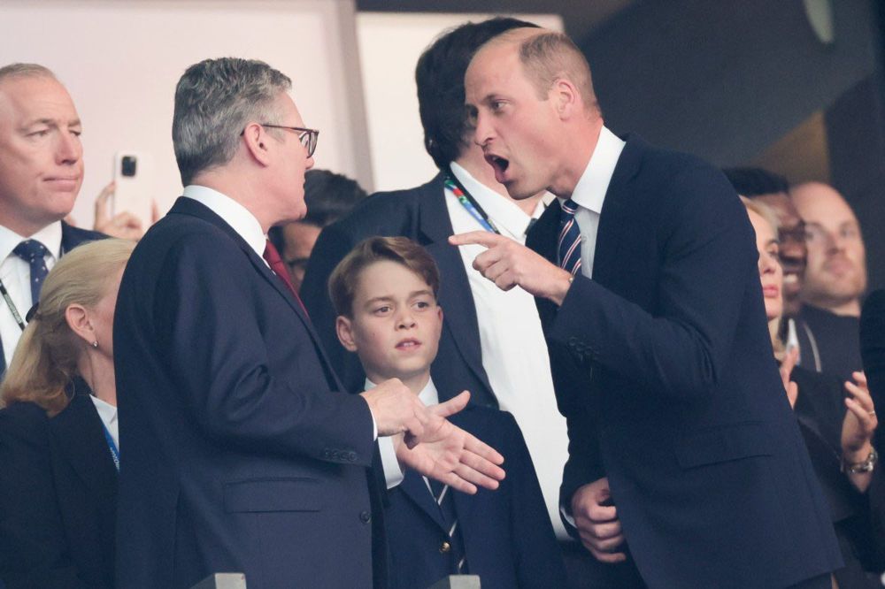 William Windsor shouting and jabbing a finger at Keir Starmer, who smiles nervously and holds his hands out like a prick. Between the pair, William's son, who is called something like George-Henry Adultery-Genocide Windsor, looks on with his trademark dead-eyed, Skeletor-like expression.