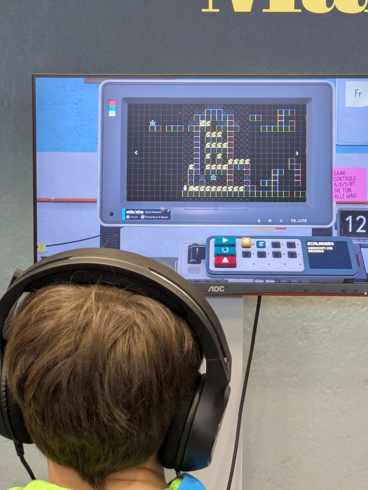 over the shoulder shot of a person playing a video game.