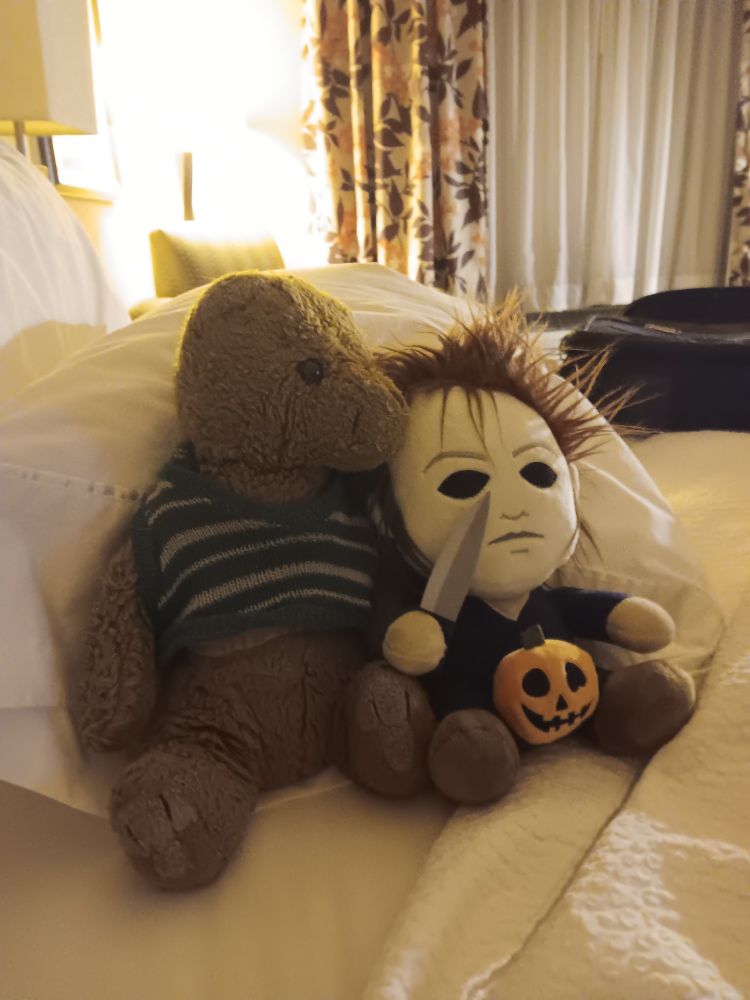 Two stuffed animals in love.