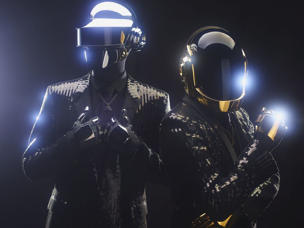 Daft Punk were a French electronic music duo formed in 1993 in Paris by Thomas Bangalter (left) and Guy-Manuel de Homem-Christo. They achieved popularity in the late 1990s as part of the French house movement, combining house music, funk, disco, techno, rock and synth-pop. They are regarded as one of the most influential acts in dance music. From 1999, Daft Punk assumed robot personas for public appearances, with helmets, outfits and gloves to disguise their identities, and made few media appearances. In 2013, the band released their fourth and final album, Random Access Memories, to acclaim. The lead single, "Get Lucky", reached the top 10 in the charts of 27 countries. The album won five Grammy Awards in 2014, including Album of the Year and Record of the Year for "Get Lucky". This promotional photograph shows Daft Punk in 2013 after the release of Random Access Memories. Type: photograph. Credits: Sony Music; edited by W.carter.
