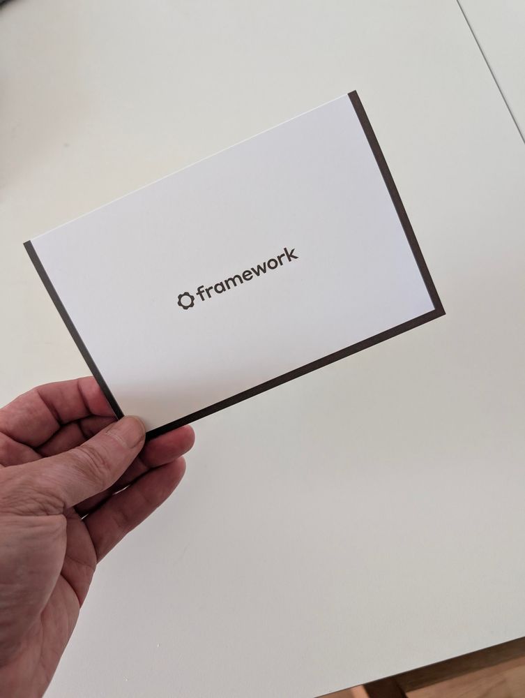 The outside of a folded paper showing the Framework name and logo