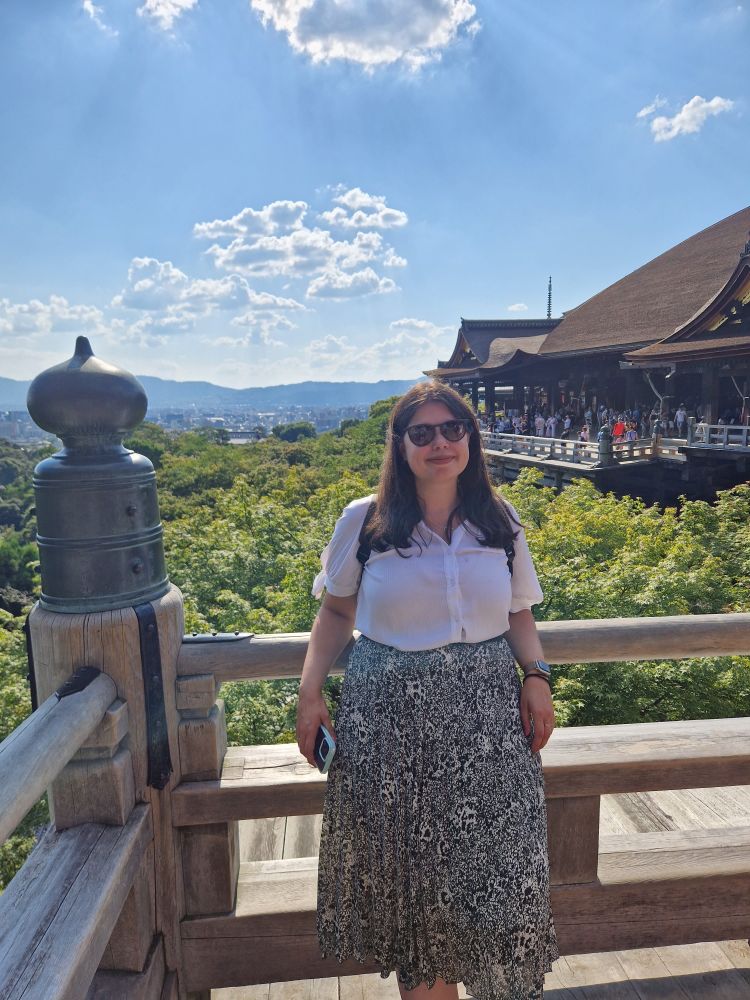 Dani with a temple in the background