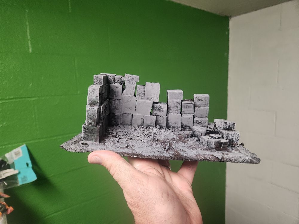 Some foam blocks on a board.  My first attempt at cutting brick with a hotwire cutter.  They came out way too big but I decided to make this with them instead.