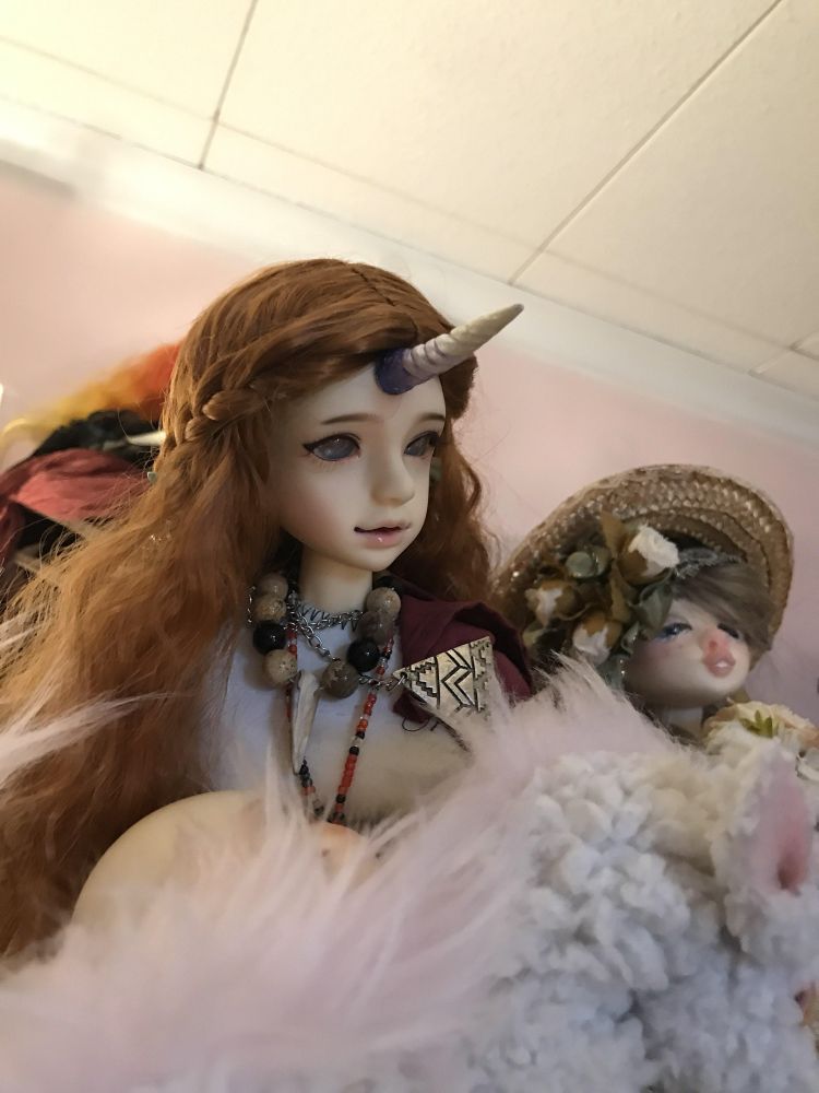 A impldoll 1/4 with a purple white horn.