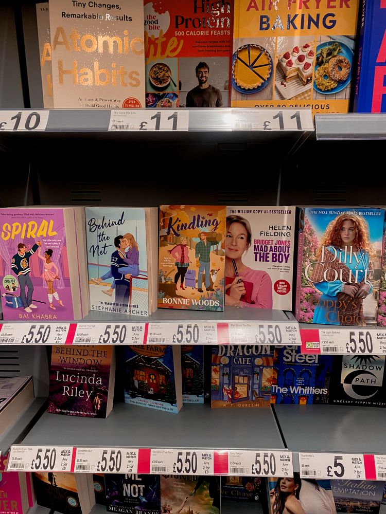 Kindling by Bonnie Woods on a supermarket shelf between Behind the Net by Stephanie Archer and Bridget Jones Mad About the Boy by Helen Fielding 