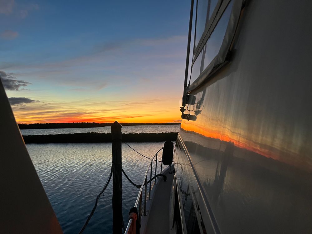 Sunset over Gulf of Mexico. Picture taken looking down the port side of Already There. Picture captioned “Maybe time to wax the old girl.”