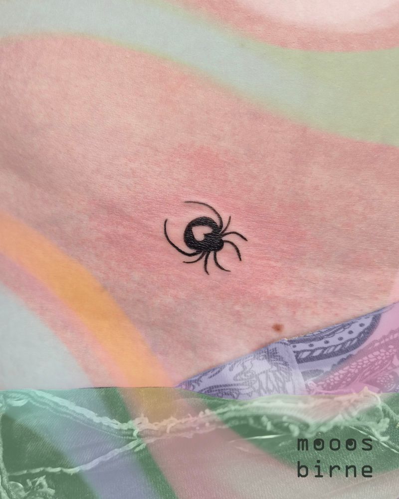 Tattoo of a spider with a heart shape on its back 