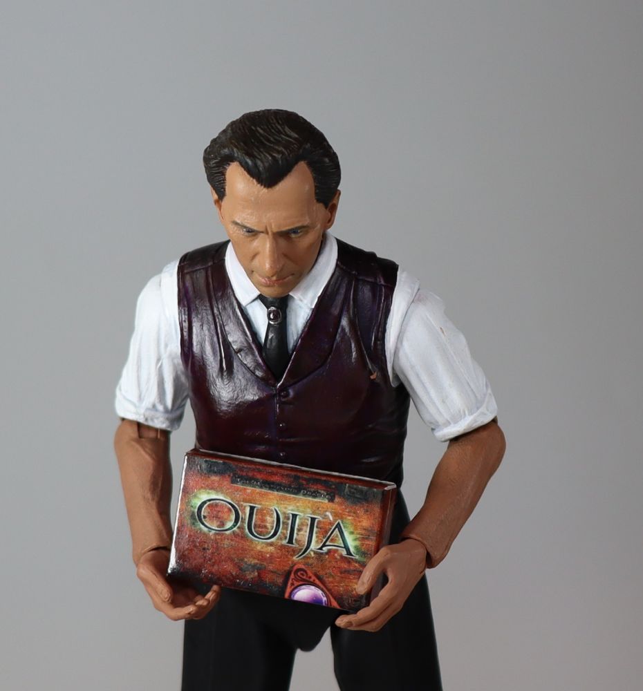 Neca ultimate van helsing holding a ouija board game