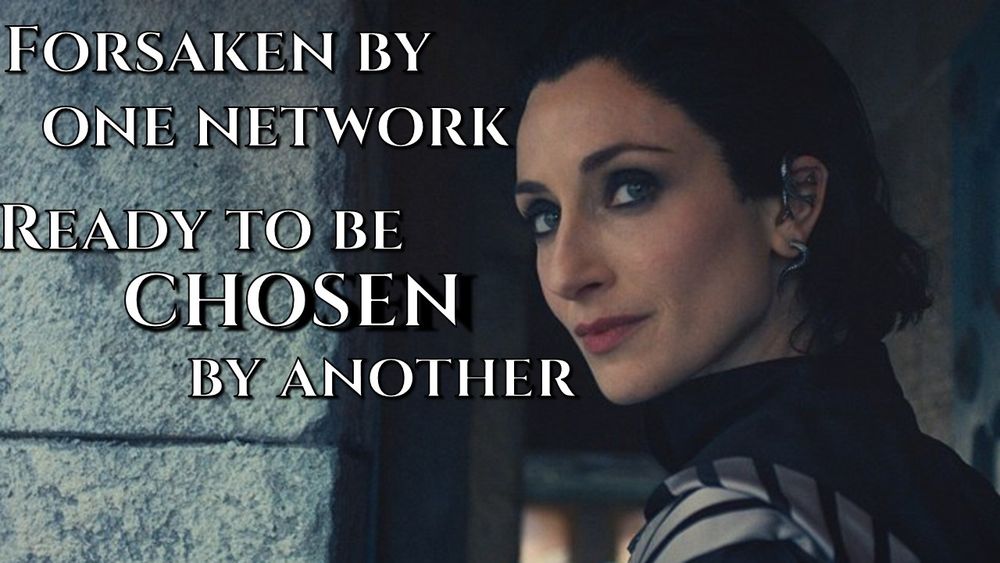 Close-up of Lanfear (Natasha O'Keeffe) from The Wheel of Time, with dark hair and a silver ear cuff, looking defiantly over her right shoulder with a slight smirk. White text on the left side of the image reads: "FORSAKEN BY ONE NETWORK. READY TO BE CHOSEN BY ANOTHER."