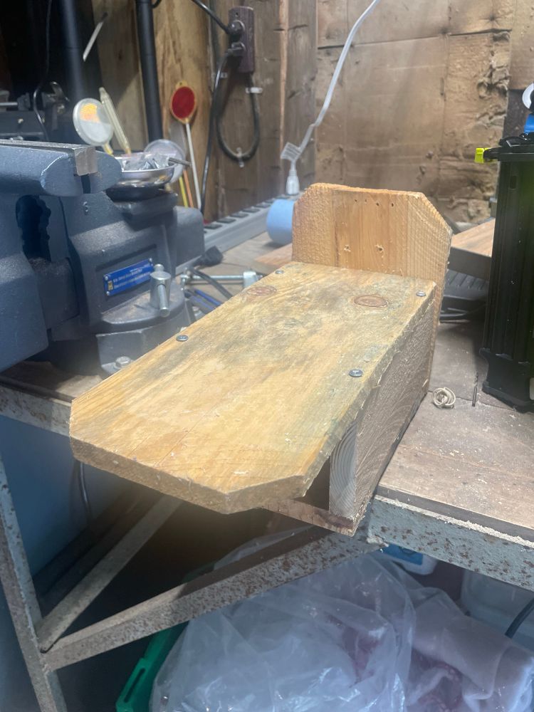 A simple wooden house for bees.