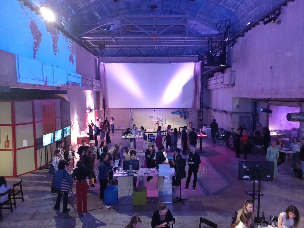 People from a distance at the FemTech + Feminist Tech Exhibition at KTH Royal Institute of Technology, where Code Couture: Breaking the STEM Dress Code project was displayed