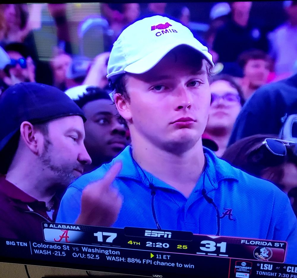 Salty Bama fan flips the bird at cameraman