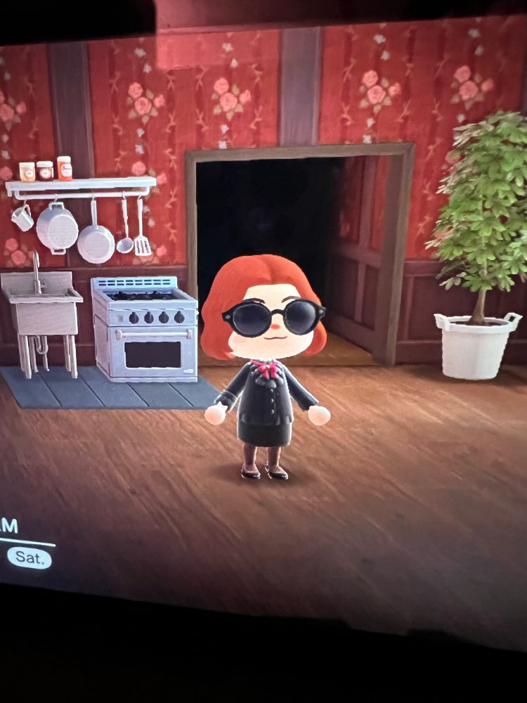 Animal Crossing character in a house. They have red hair and sunglasses and look as much like Nanny Asthtoreth as I could get them.