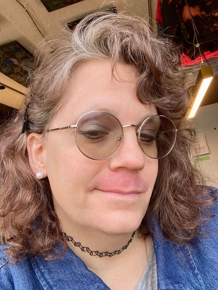 Mollz with a red upper lip.